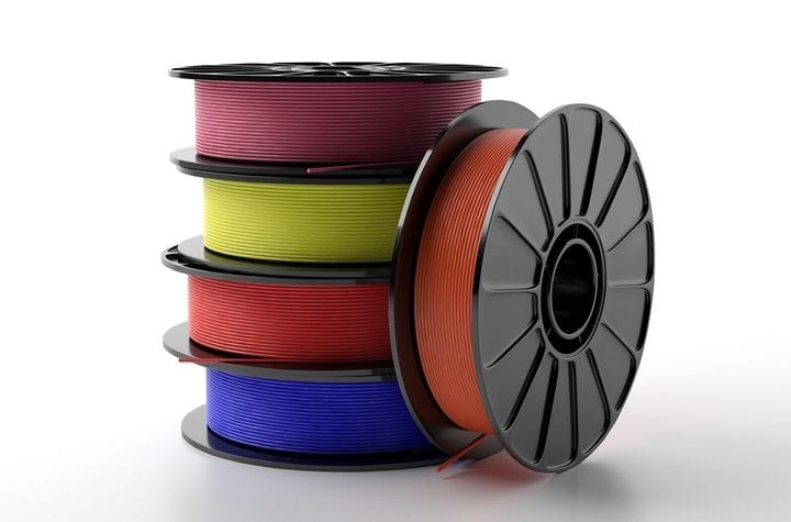 Spools of 3D printing filament in multiple colors