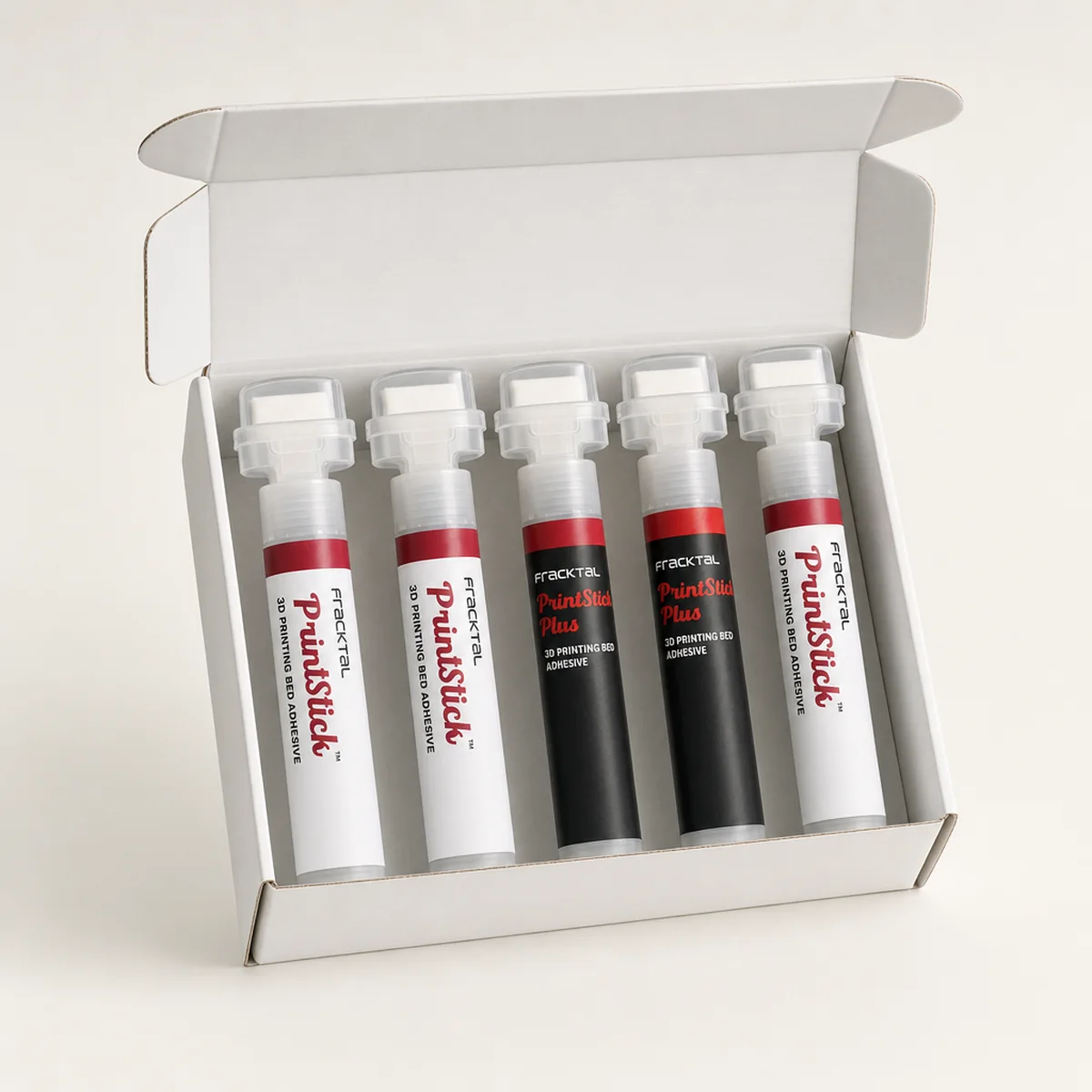 An open carton of five PrintStick applicators