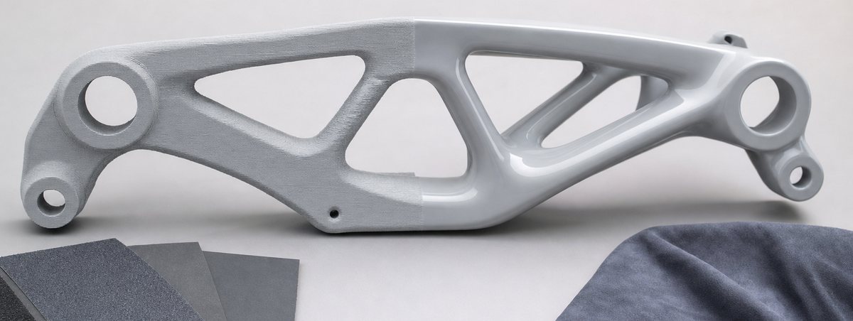 A printed part half finished, beside abrasives