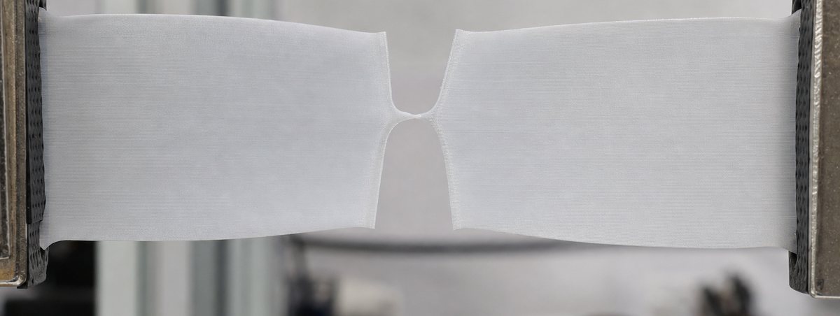 A nicked flexible sheet being pulled apart