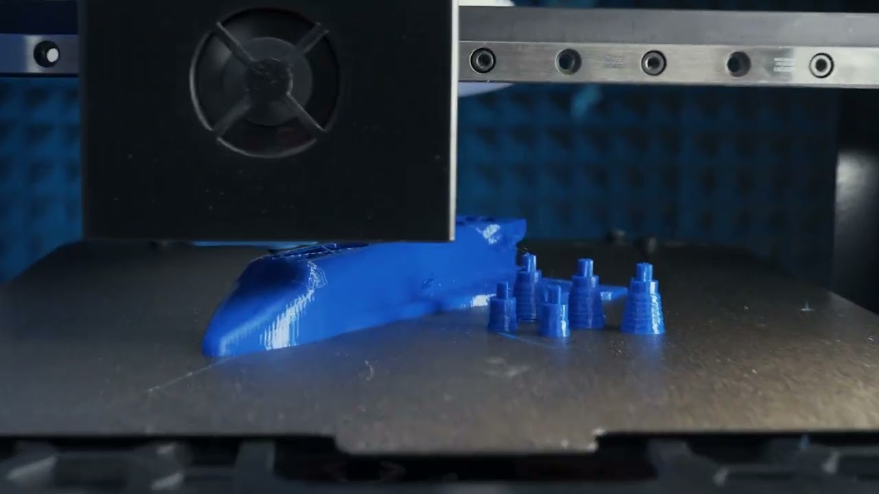 Fracktal Snowflake 3D printer printing blue parts on its build plate