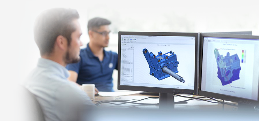 Design engineers reviewing a CAD model